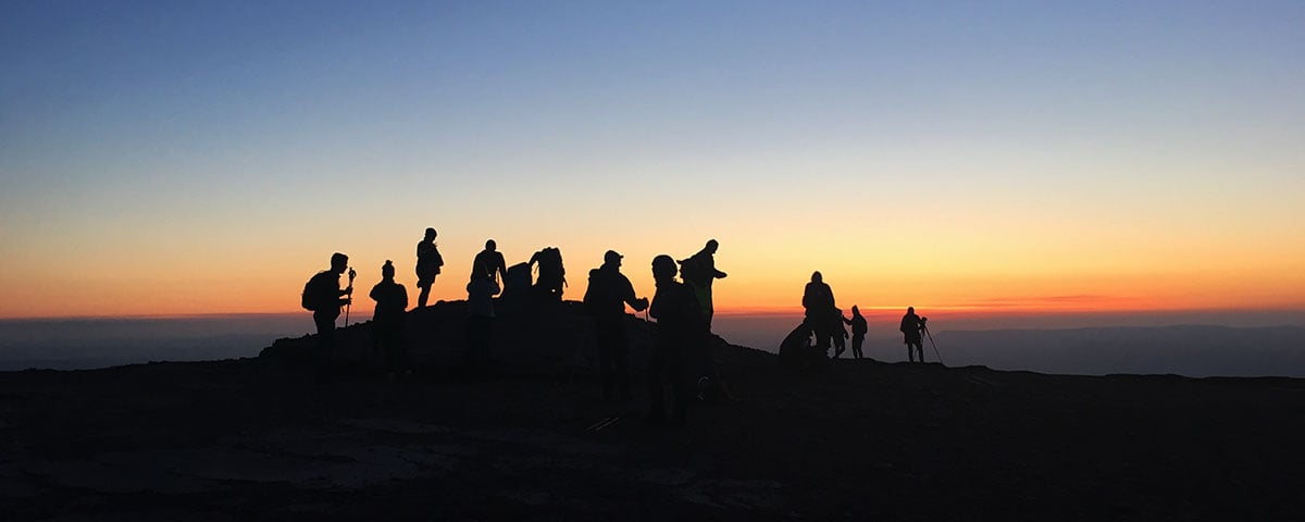 Our Welsh Three Peaks Challenge group finishing in sunset on Pen y Fan